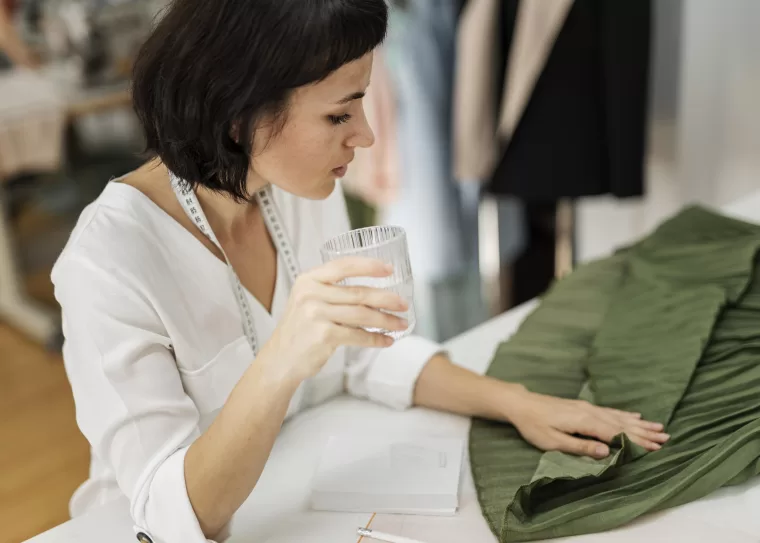 Fashion designer preparing a garment using eco-friendly materials