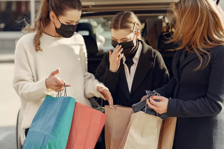 Young women buying luxury fashion during Covid-19