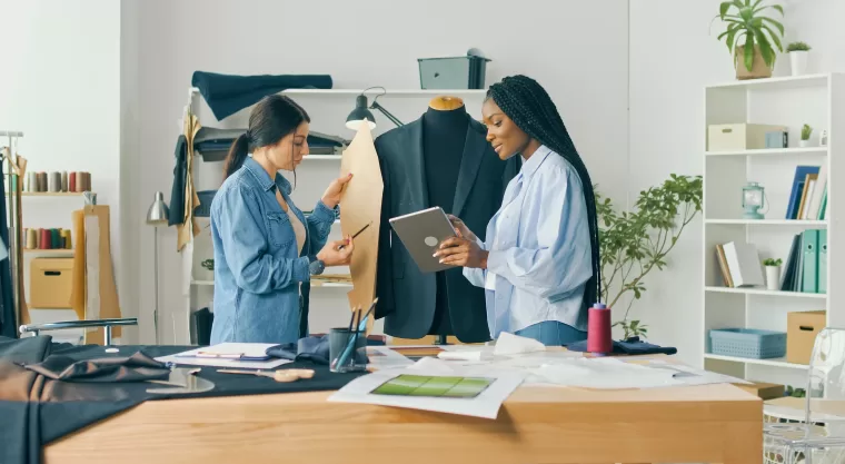 Fashion designers discussing a suit design