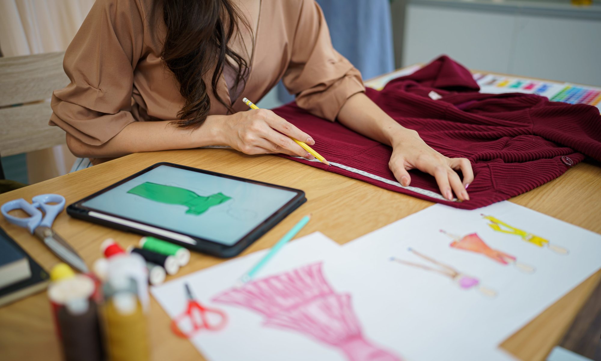 Fashion designer sketching new collection