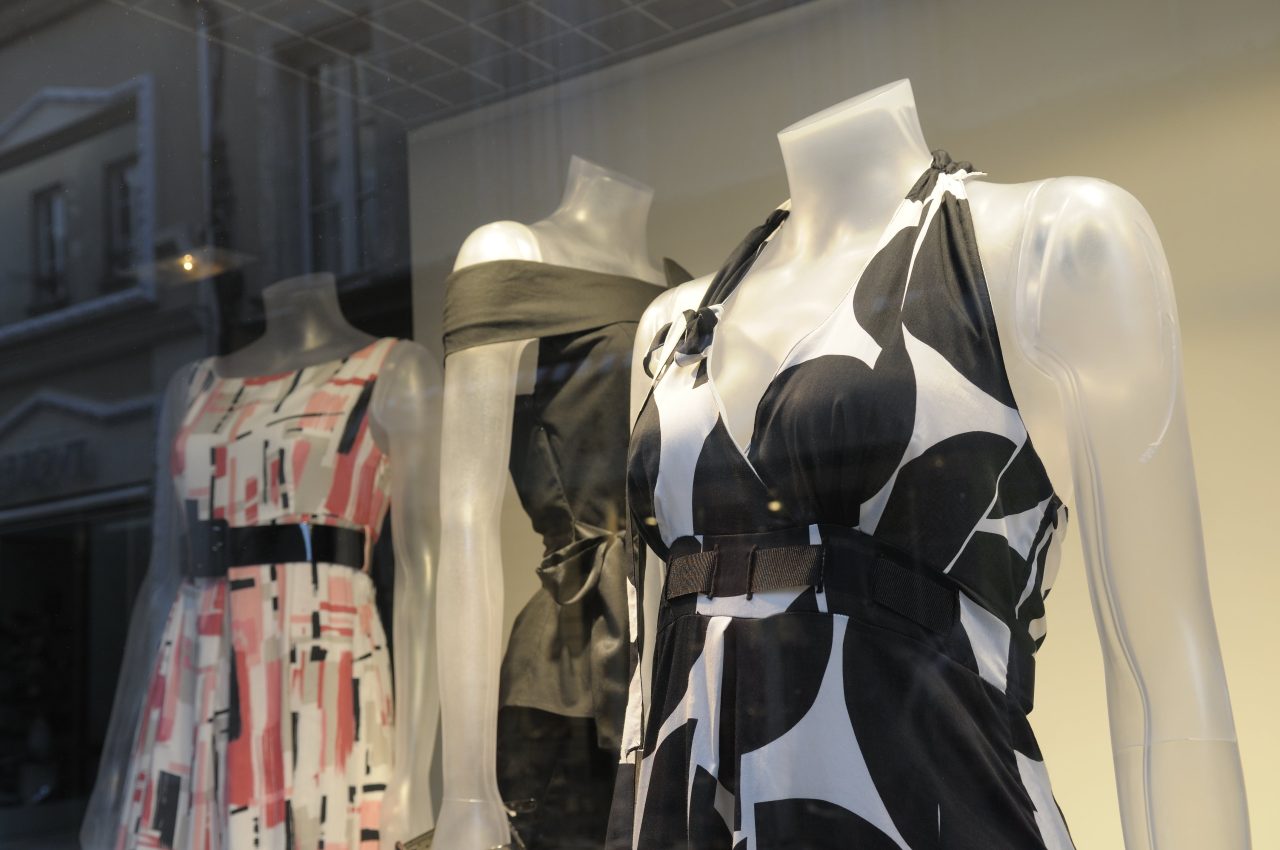 Clothes on mannequins in a shop window Clothes on mannequins in a shop window