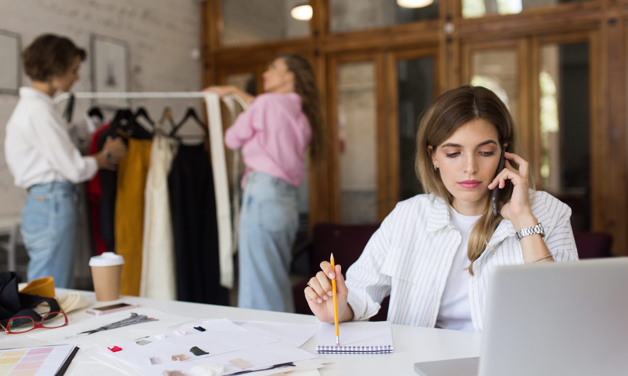 Woman working in a small fashion office