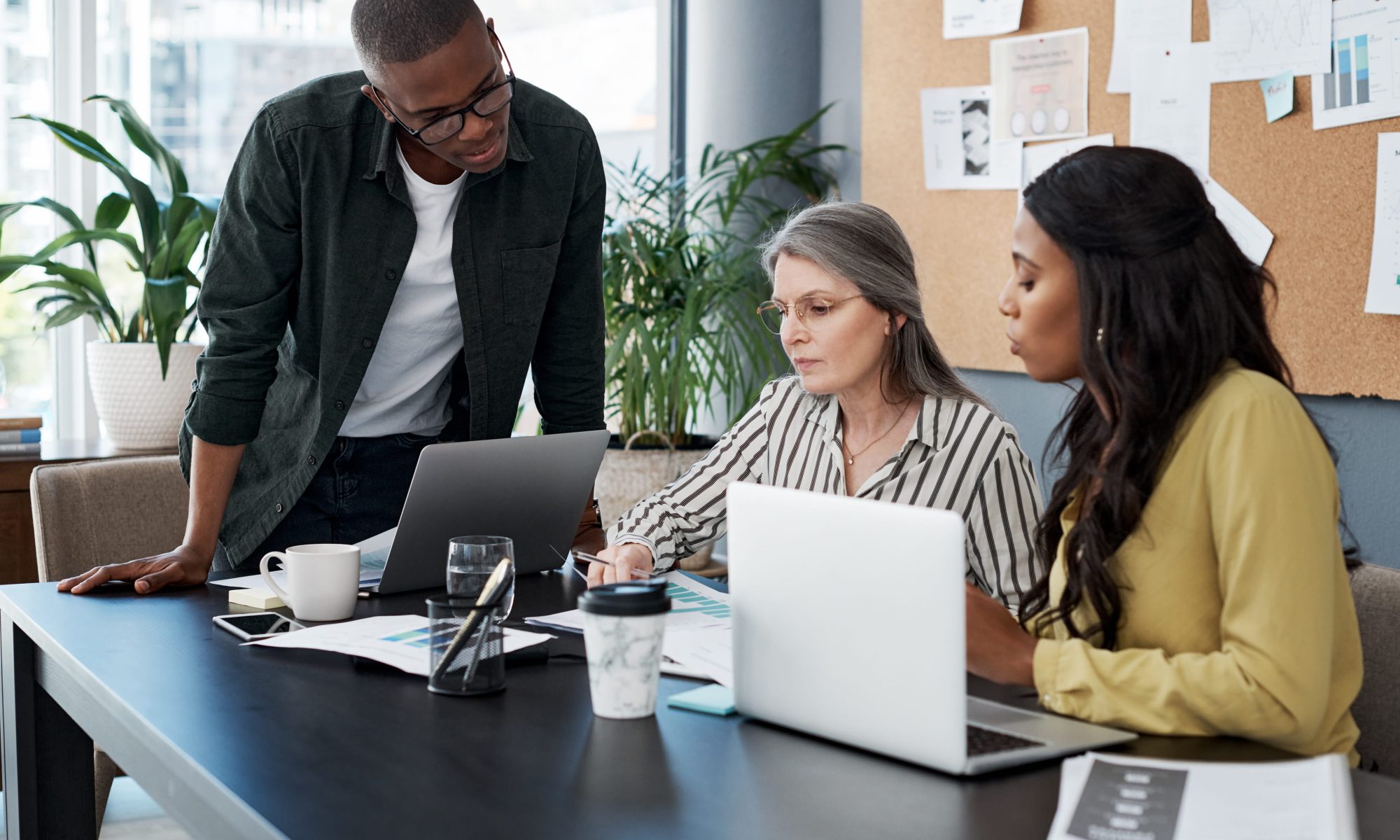 Three colleagues working on ERP implementation